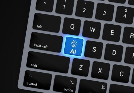 a close up of a keyboard with a blue button