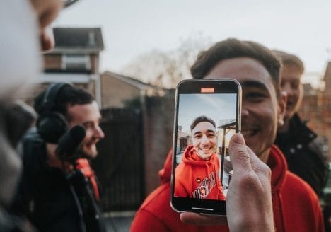 a man taking a picture of himself on his phone